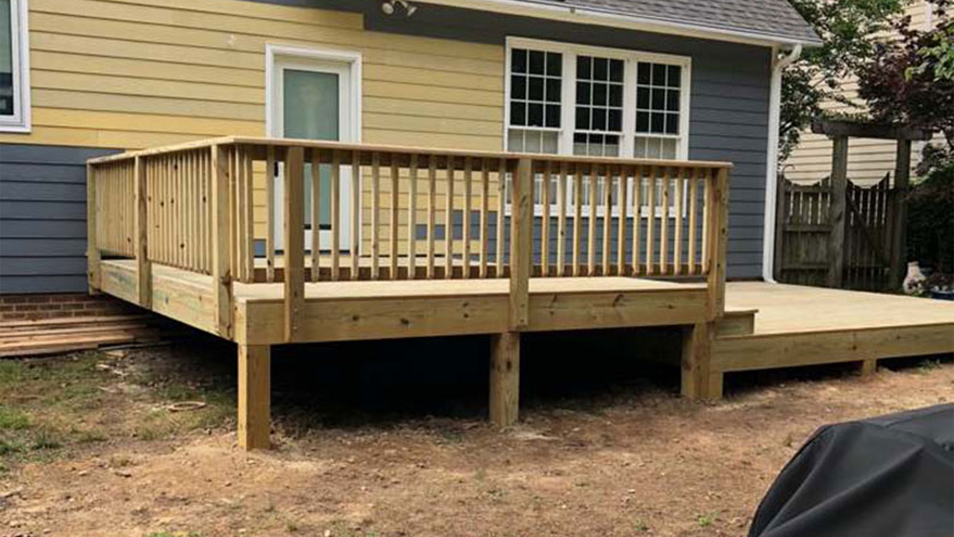residential property exteriors with new deck installed raleigh nc