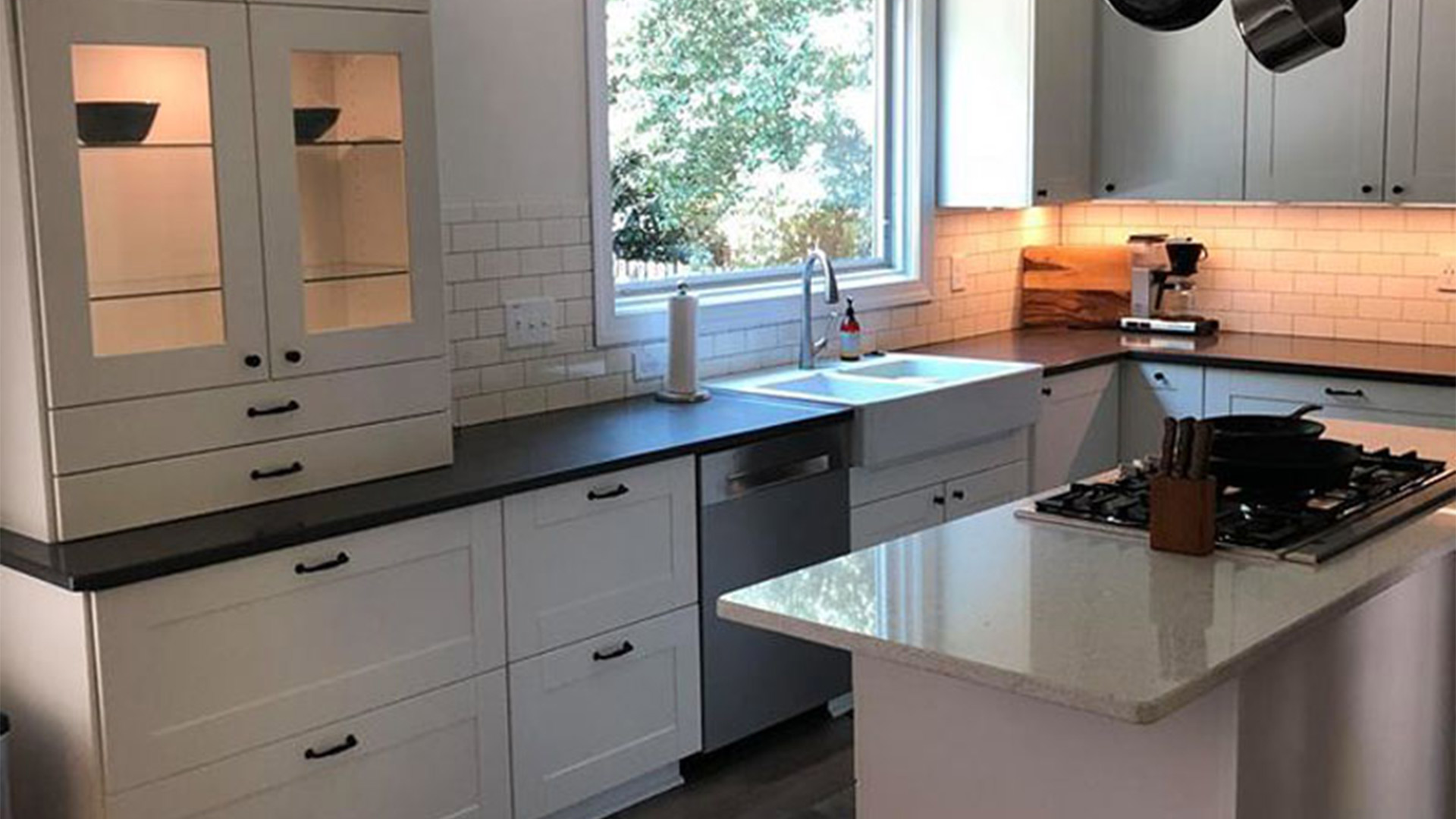 residential property kitchen interiors with wooden white cabinets and black countertops raleigh nc